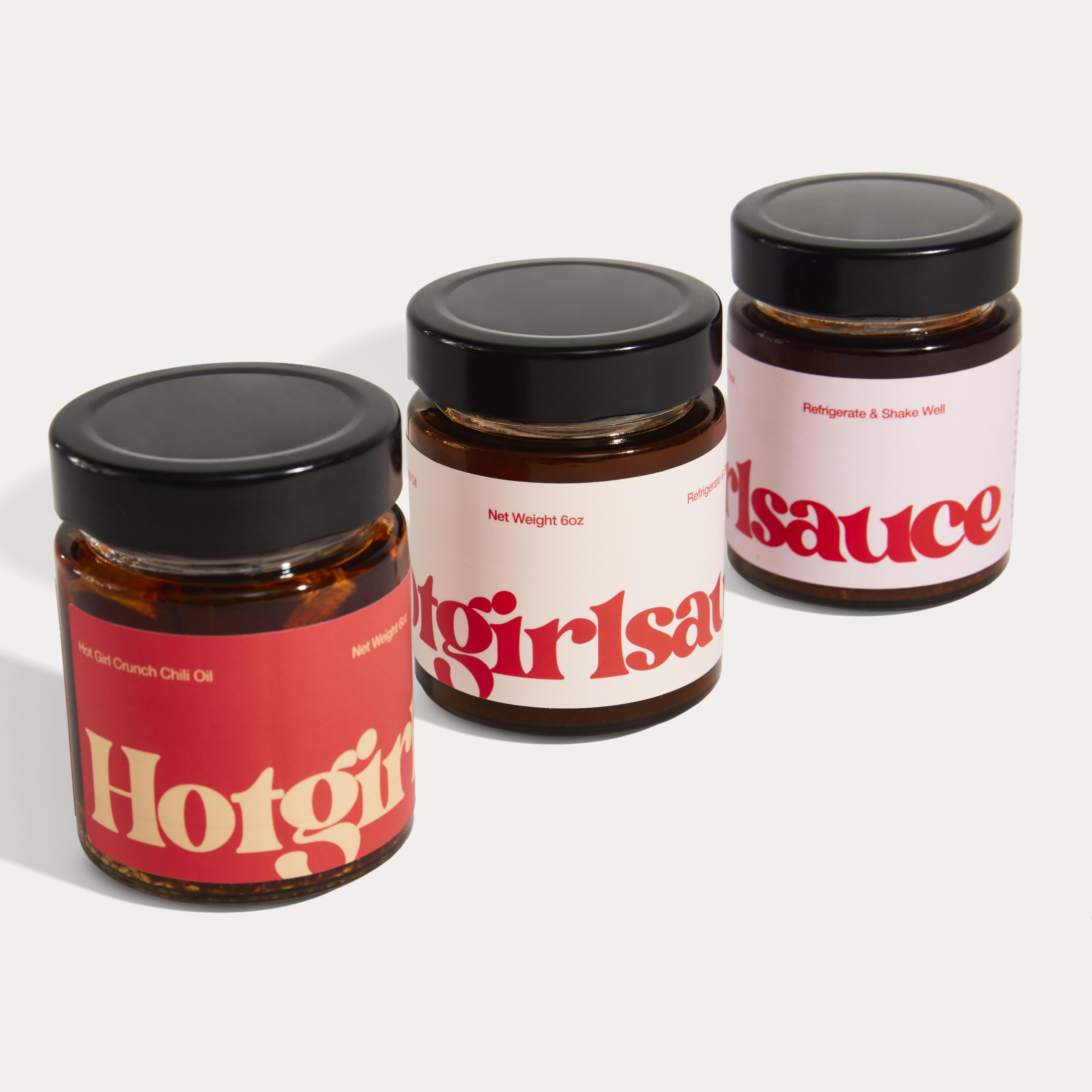 Three Hotgirlsauce chili oil jars